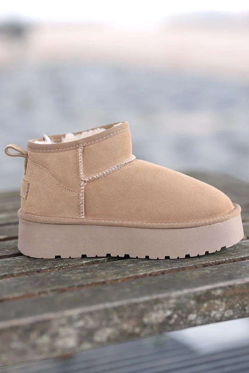 Bottes beige basses en cuir fourrées à plateforme