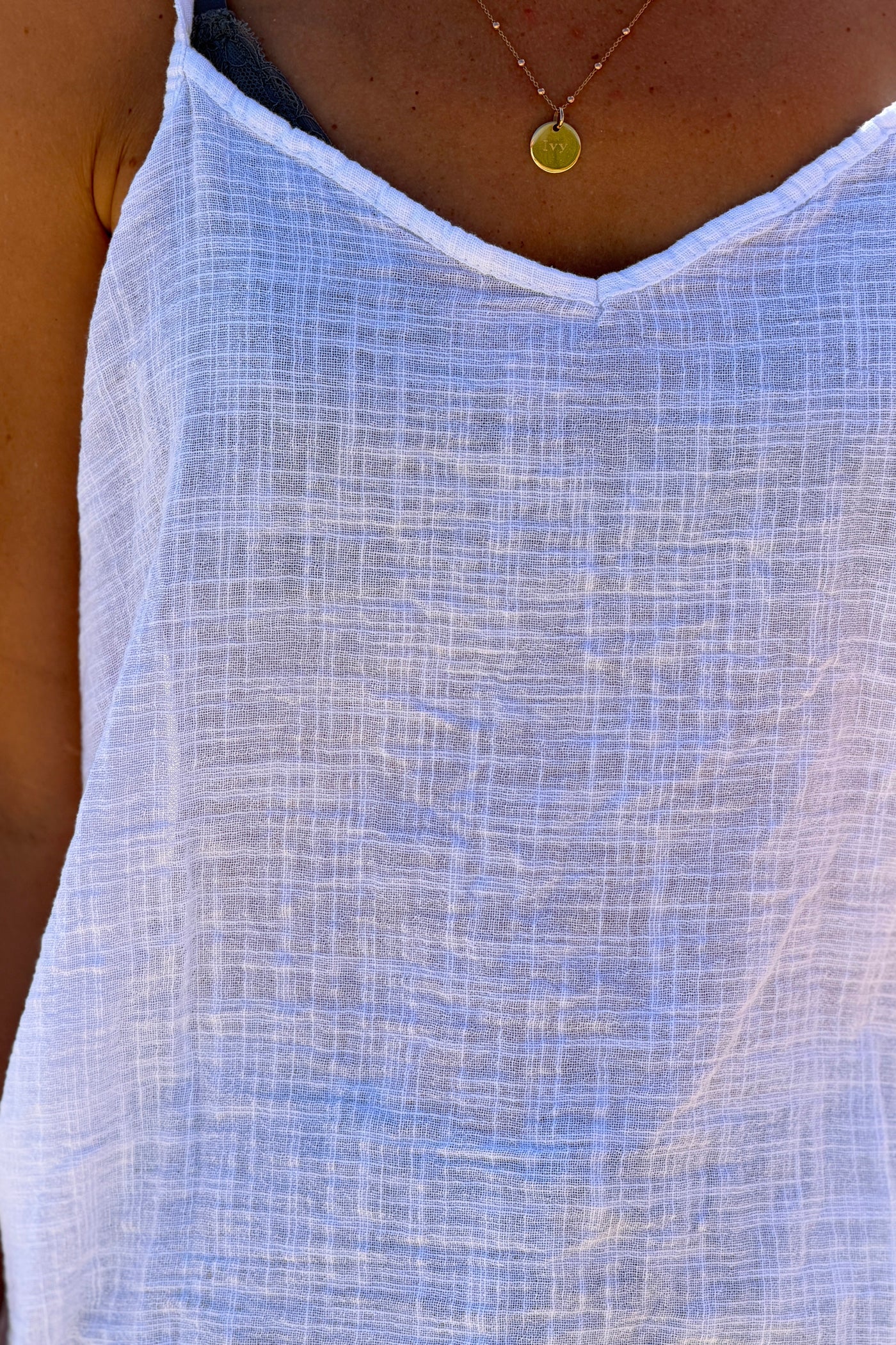 Top blanc à bretelles en coton effet piqué